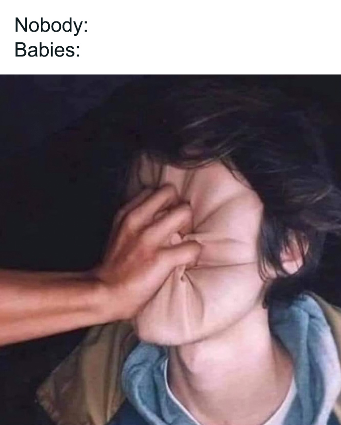 Hand pressing a person's face humorously, resembling toddler behavior; text reads "Nobody: Babies:".