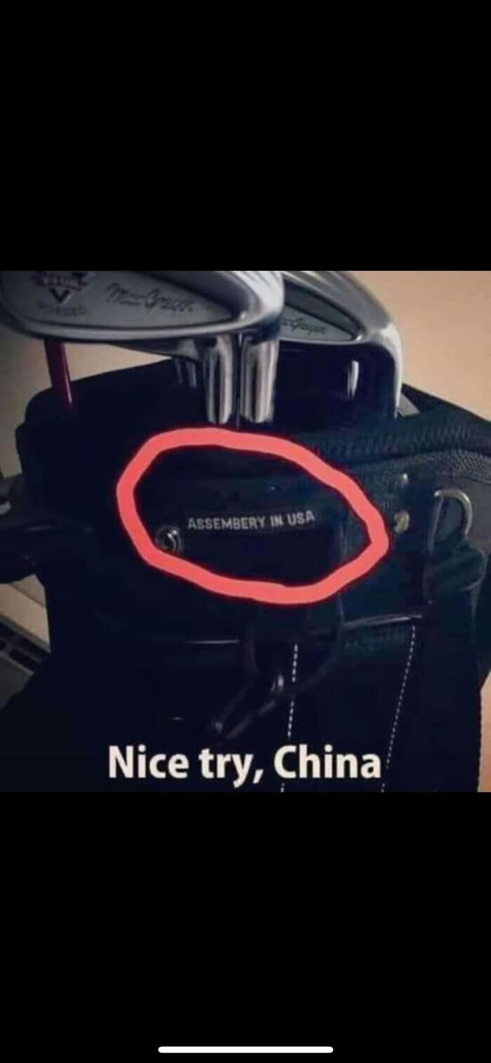 “Golf bag with misspelled 'Assembery in USA' label, humorously highlighted.”