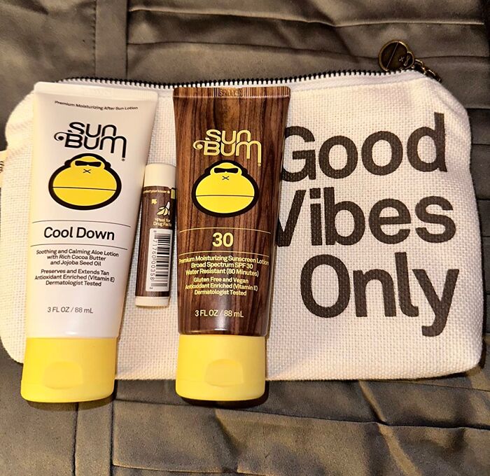Sun B*m skincare products on a bag with "Good Vibes Only" text.