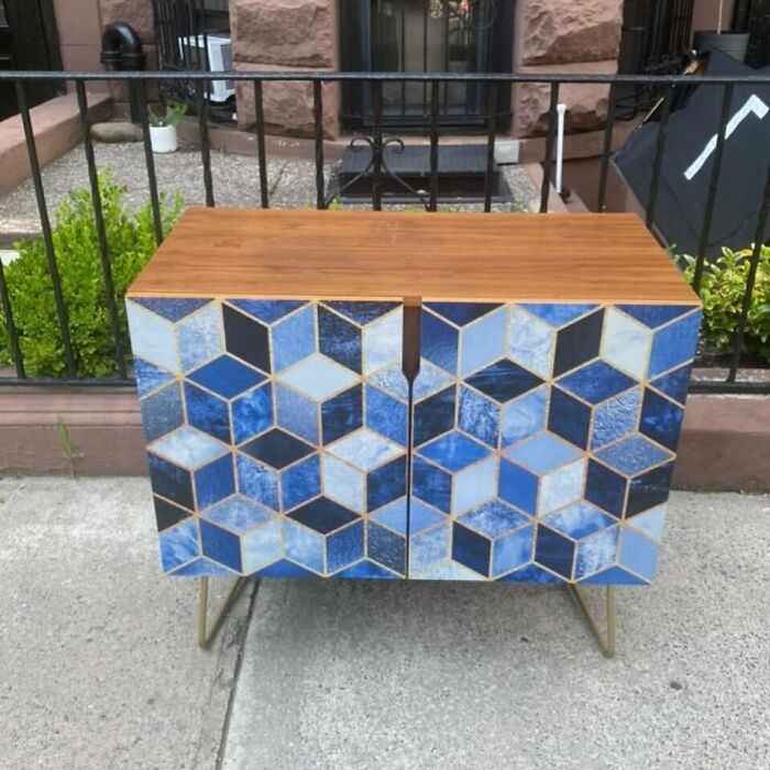Colorful geometric cabinet left on NYC curb for stooping treasure hunters.