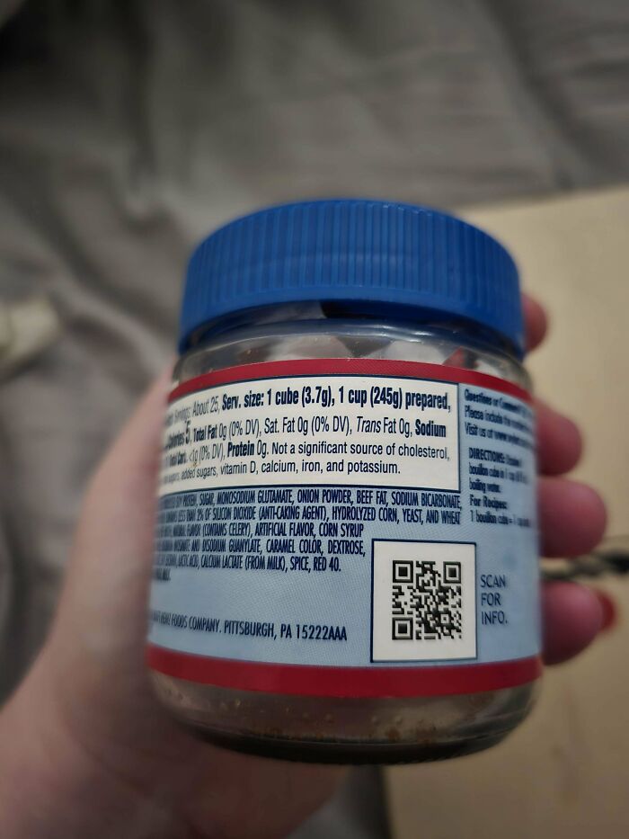 Jar with blue lid featuring a detailed ingredients label, categorized as a bizarre dish concept.