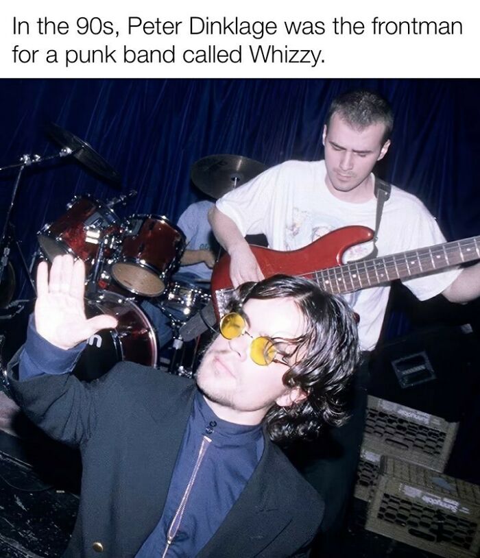 90s punk band performance with musicians playing guitar and drums, evoking nostalgia for Tamagotchis and VHS tapes.