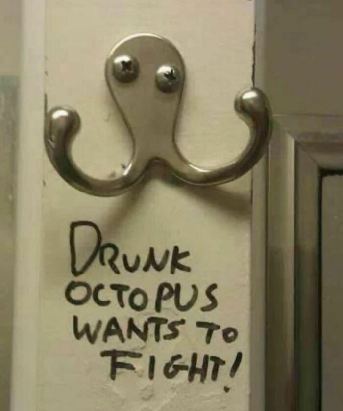 Wall hook resembling a funny, awkward octopus with graffiti saying "Drunk octopus wants to fight!"