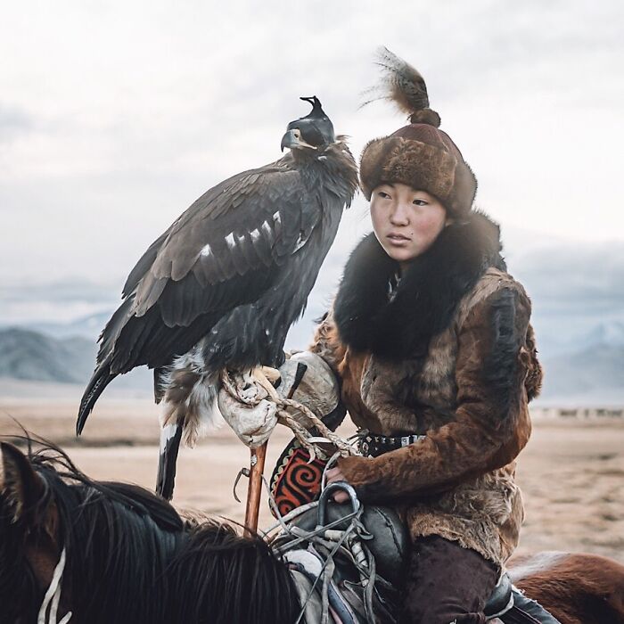 A Mongolian Huntress With Her Pet Eagle