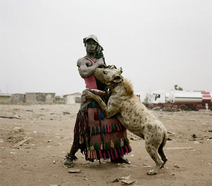A Man With His Pet Hyena. Photography By: Pieter Hugo