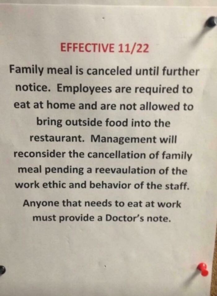 Notice about family meal cancellation at a restaurant highlighting ridiculous capitalism and strict employee rules.