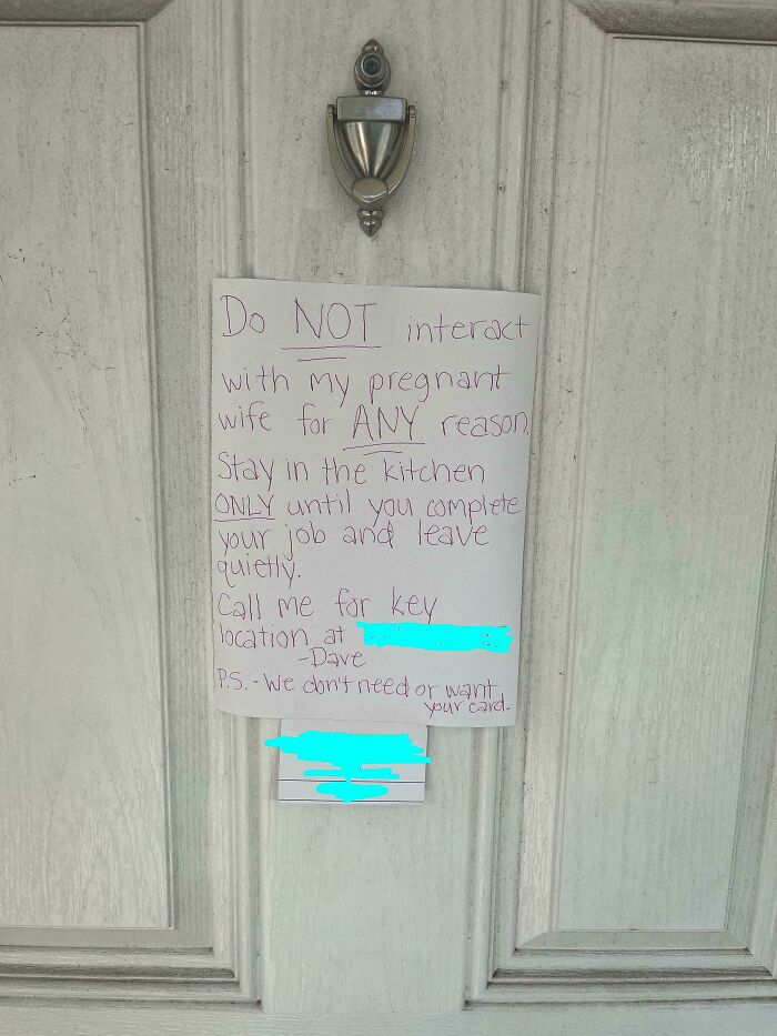 Note on a door instructing delivery workers to only stay in the kitchen and not interact with pregnant wife, illustrating ridiculous capitalism.