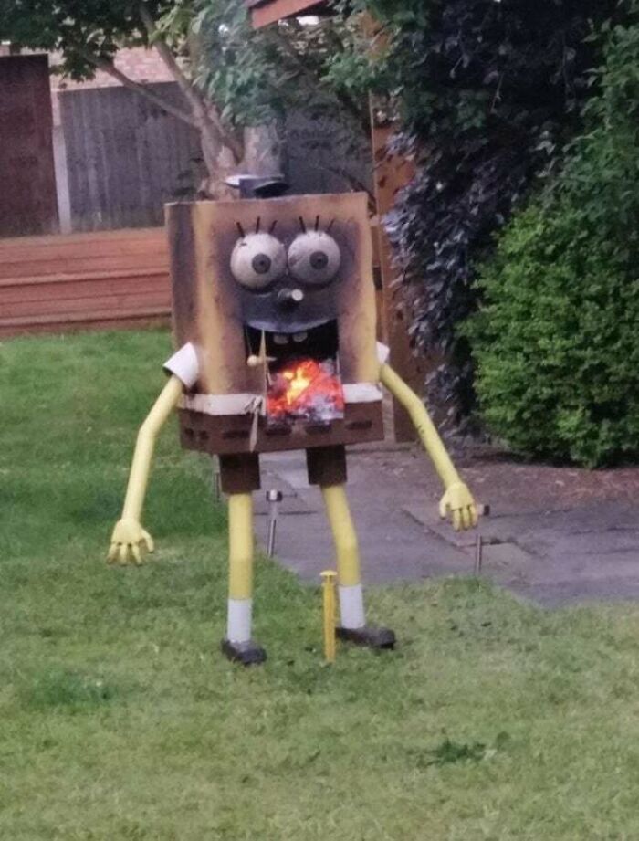 Humorous bad rip-off of a well-known brand character in a backyard with burning paper inside its mouth.