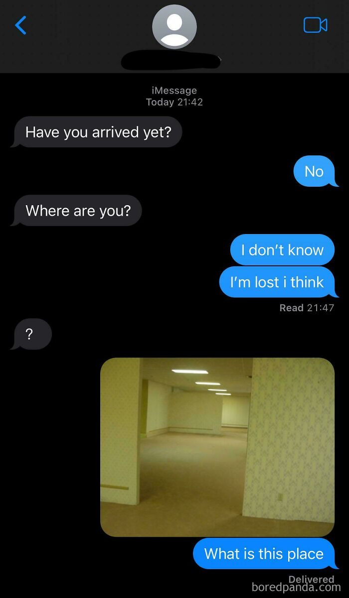 Unhinged wrong number text exchange showing confusion about location with an empty room photo.