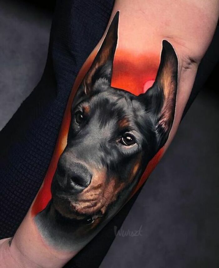 Realistic Doberman tattoo design showcasing skilled artistry.
