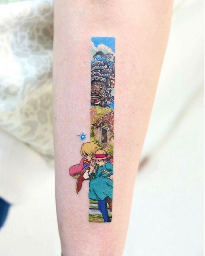 Colorful tattoo design on forearm depicting a scene from an animated movie, showcasing artistic detail.