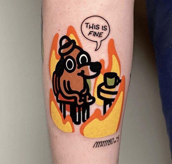 Creative tattoo design of a cartoon dog saying "This is fine" surrounded by flames, showcasing artist skill.
