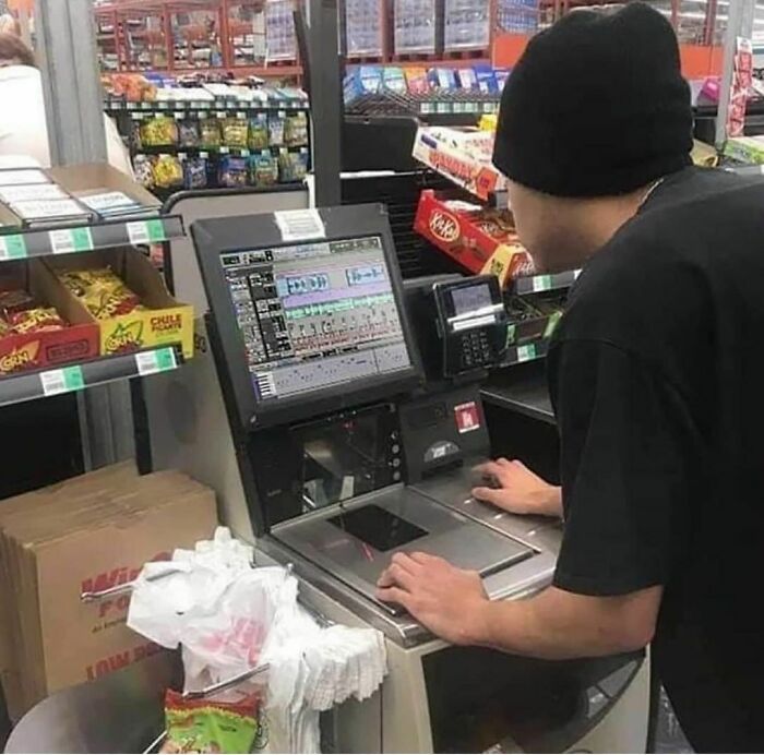 Person using a checkout machine with advanced graphics at a store, embodying a "pics that go hard" moment.