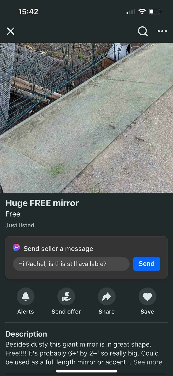 Confusing photo of a large mirror for sale, appearing like a concrete slab, listed as free in an online marketplace.