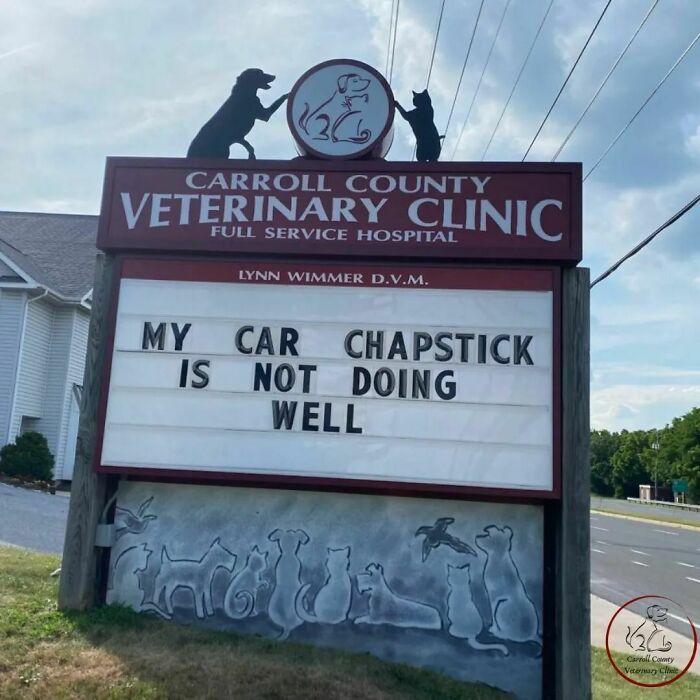 Veterinary clinic sign with a joke: "My car chapstick is not doing well," featuring animal silhouettes.