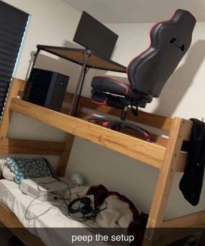 Unique desk setup on a bunk bed with gaming chair and computer, showcasing creative workspace design.