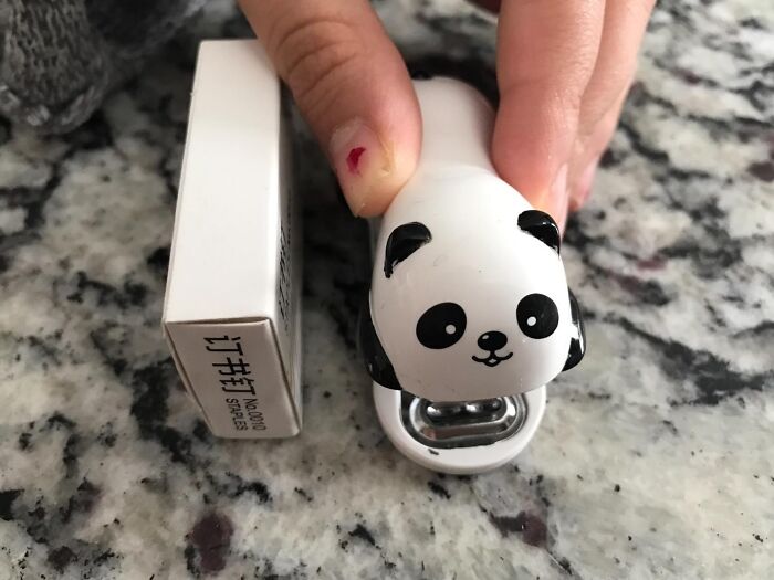 Panda-shaped stapler on a desk, perfect for office fun and creativity.