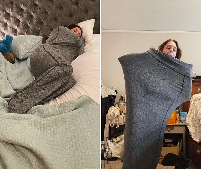 Person wrapped snugly in oversized gray pants, lying on bed; holding pants to show size in bedroom. Weird things discovery.