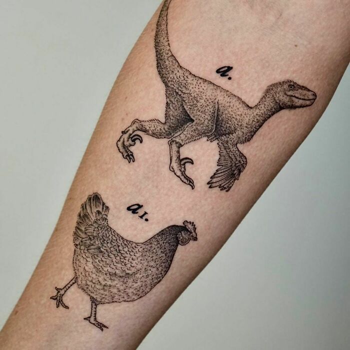 Dinosaur tattoo paired with a chicken on a forearm, showcasing creative body art.