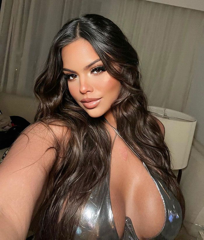 Gracie Bon in a silver outfit showing body transformation.