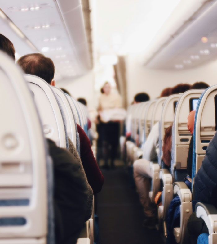 Woman Baffled To See Flight Attendant Is Her Boyfriend After He Got Up To Use The Restroom