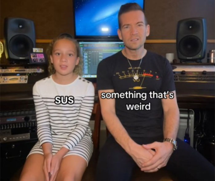 Dad and daughter discussing slang in a recording studio for Gen Alpha communication.