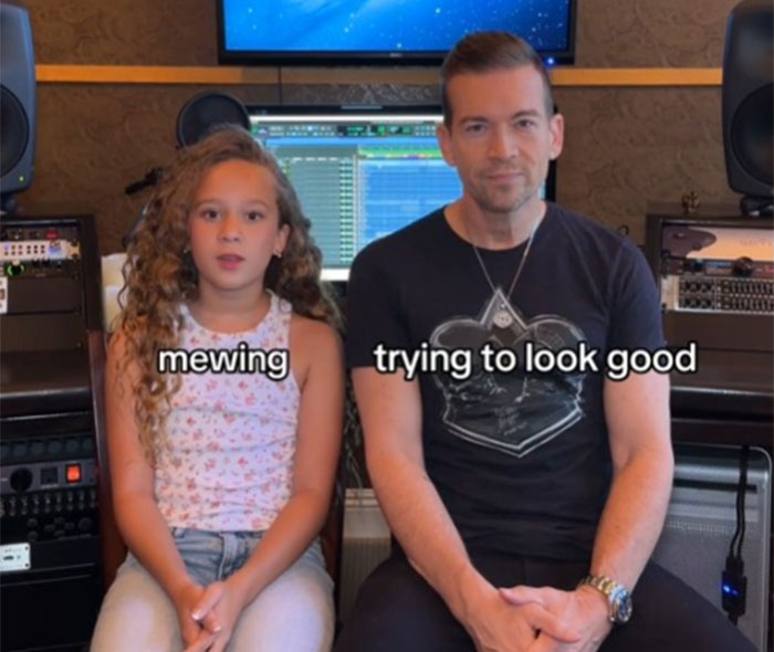 Dad and daughter in a music studio, discussing Gen Alpha slang with playful expressions.