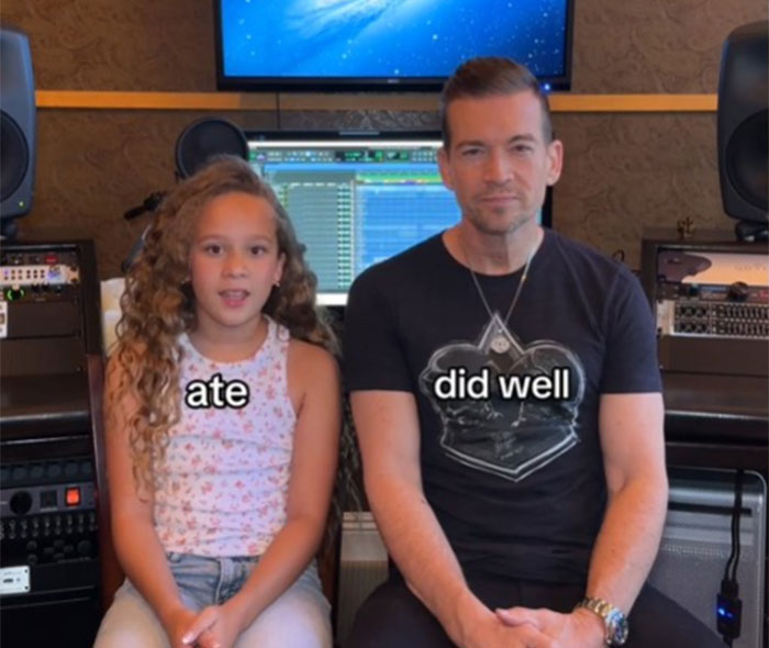 Father and daughter sitting together, learning Gen Alpha slang in a recording studio.