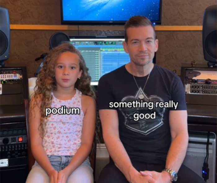 Dad learning slang from daughter in a recording studio.