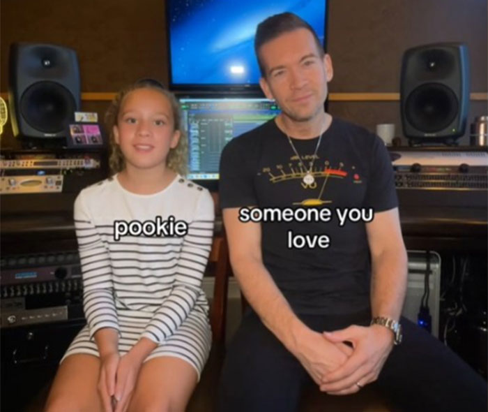 Father and daughter in a recording studio as she teaches him Gen Alpha slang.