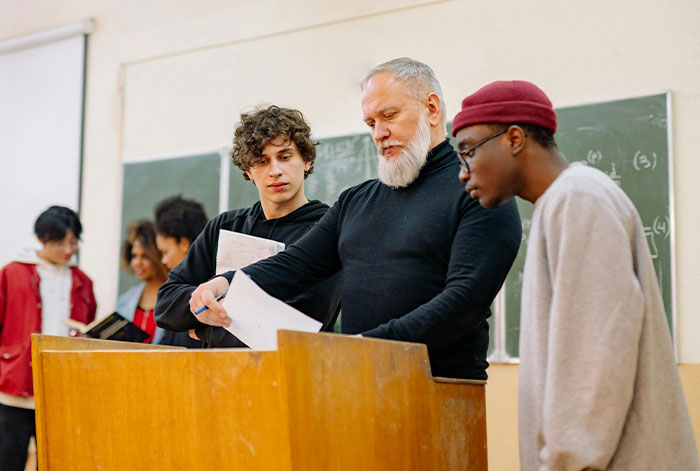 Teacher Banned From Wearing Sneakers Due To Dress Code, Responds With Goth Platform Boots Teacher Banned From Wearing Sneakers Due To Dress Code, Responds With Goth Platform Boots