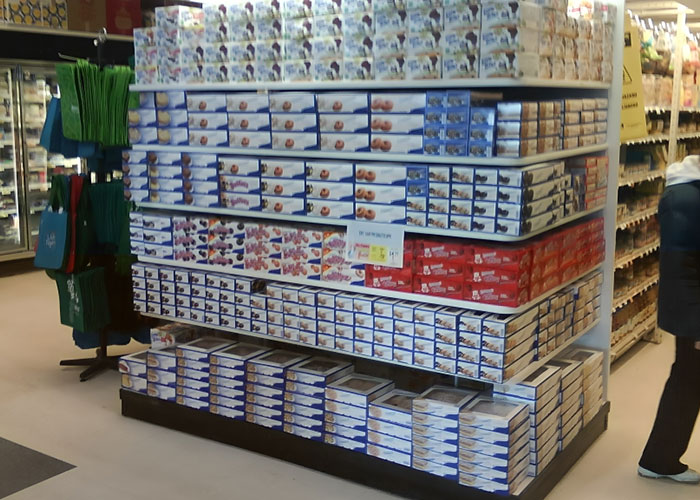 Supermarket shelf overloaded with mismatched products illustrating colossal mess-ups people have made at work.