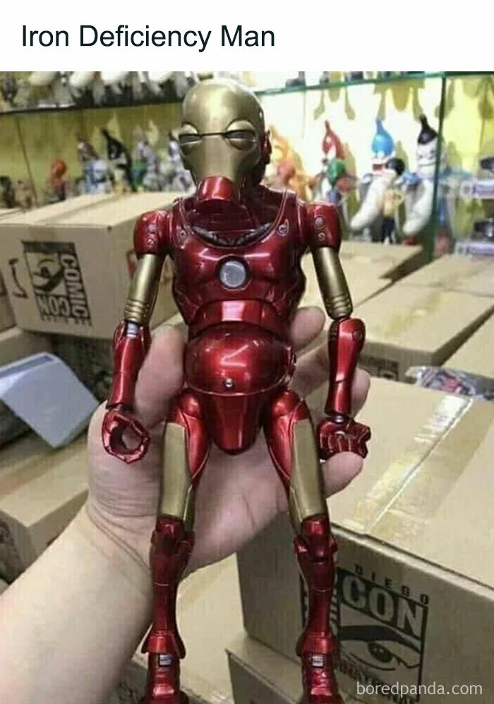 Hand holding a poorly made knockoff Iron Man action figure illustrating bad rip-offs of well-known brands.