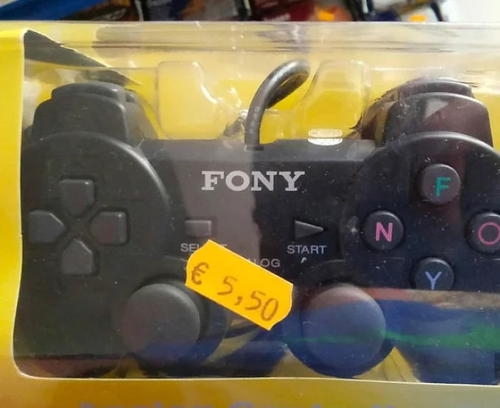 FONY video game controller rip-off resembling a well-known brand, with colorful buttons and a price tag in a plastic box.