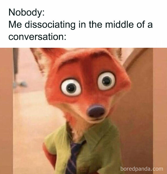 Cartoon fox with wide eyes, wearing a green shirt and tie, humorously depicts relatable dissociation.