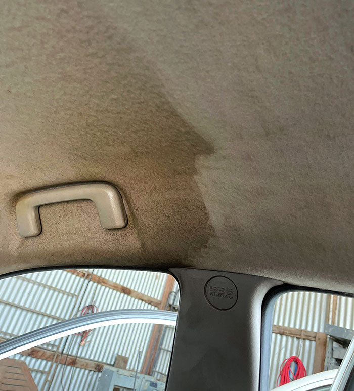 The Roof Lining Of A Chain Smoker's Car Mid-Vacuum