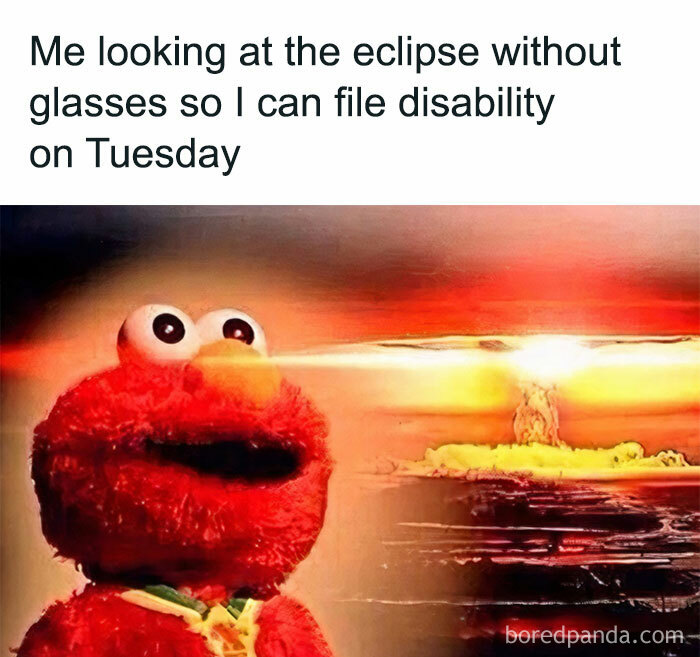 Elmo looking at a bright explosion, with text joking about filing for disability on Happy Tuesday.