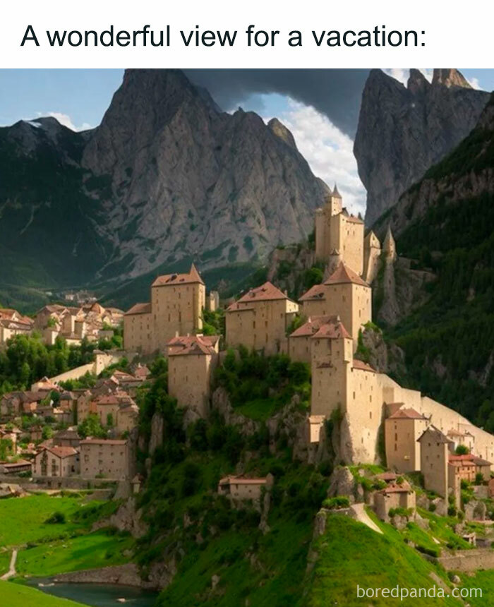 A vacation meme showing a picturesque view of a fictional medieval village from a video game, with stone buildings and castles nestled in a lush, mountainous landscape. The text above the image reads, "A wonderful view for a vacation:" The image highlights the beauty and appeal of the in-game location as an ideal vacation spot.