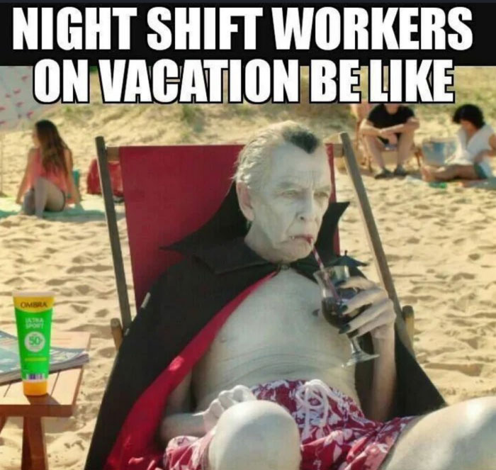 A vacation meme showing an old vampire, resembling Dracula, sitting on a beach lounge chair wearing a red cape and red swim trunks. He is sipping a dark drink with a straw and has a bottle of sunscreen beside him. The text above the image reads, "Night shift workers on vacation be like."