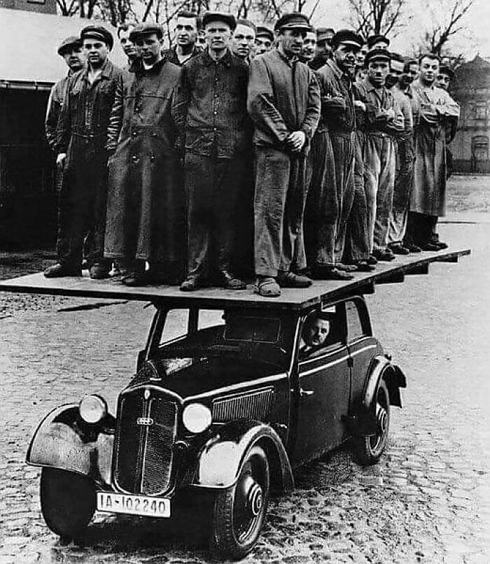 Audi Workers Demonstrating The Body Strength Of The Audi 920 (1938)