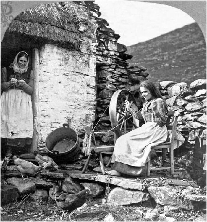 A Mother Teaching Her Daughter How To Use A Spinning Wheel, Ireland - 1904