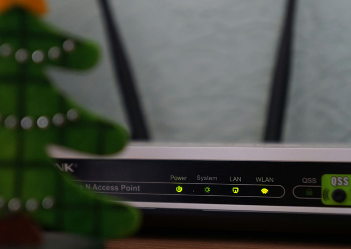 Wireless router with glowing status lights illustrating hilariously embarrassing computer attempts with technology understanding.