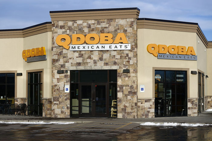 Exterior view of Qdoba Mexican Eats restaurant showcasing the facade, relevant to lifetime supply winnings stories.