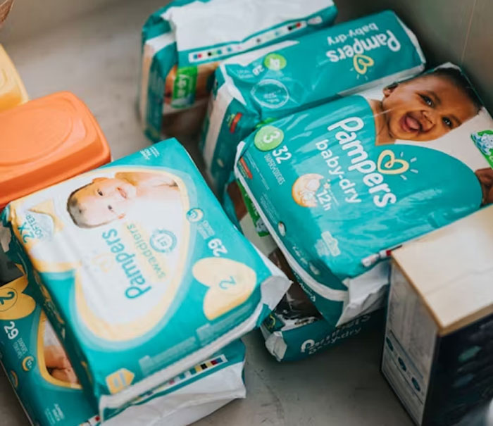 Packages of Pampers diapers stacked together, illustrating lifetime supply winnings in baby products.