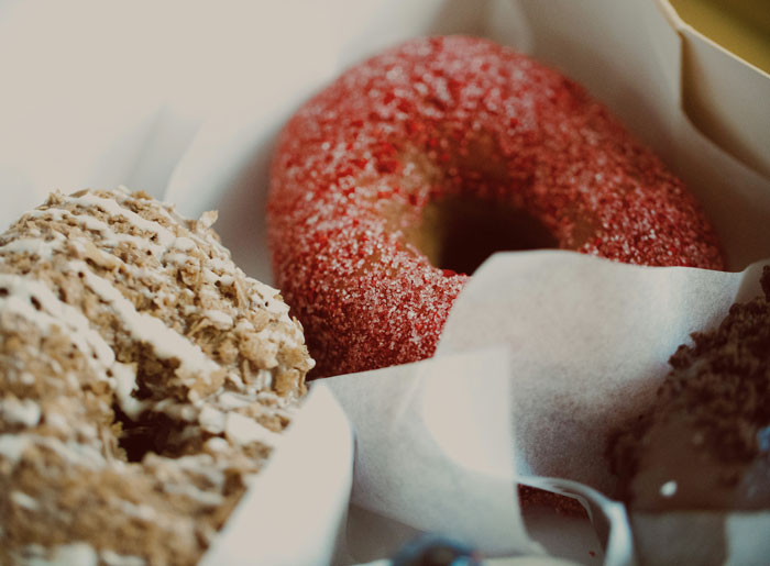 Assortment of donuts in a box representing lifetime supply winnings of sweet treats for an indefinite time.