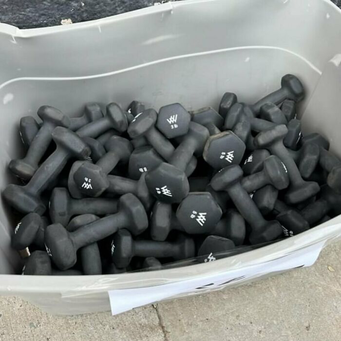 Container of black dumbbells left on the curb, discovered while stooping in NYC.