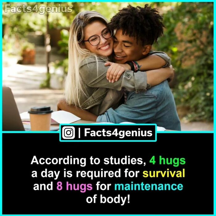 Young couple hugging joyfully outdoors, illustrating interesting facts about daily hug benefits for well-being.