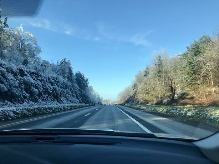 Winter On One Side Of The Road And Fall On The Other