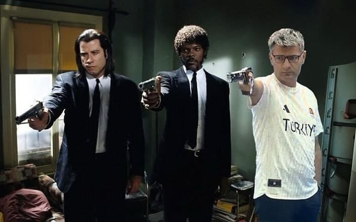 Three men in suits and a casual shirt point guns; a striking image fitting the "Pics That Go Hard" theme.