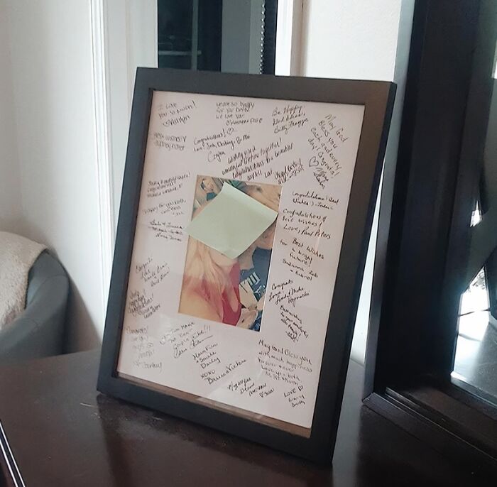 Photo frame with handwritten messages and a photo covered by a sticky note, illustrating creative life hacks for organization and memory.